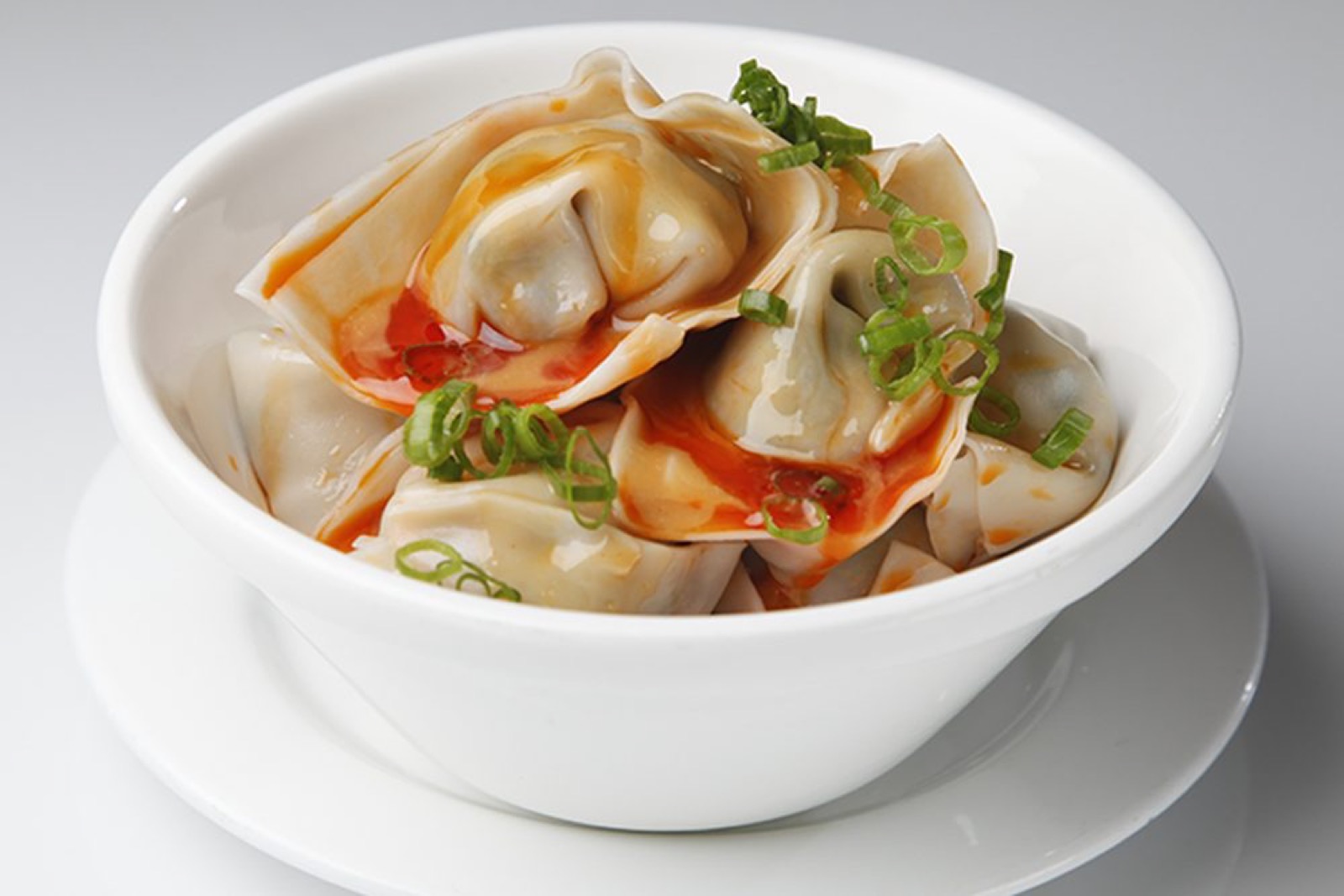 Pork and vegetable wontons in chili oil